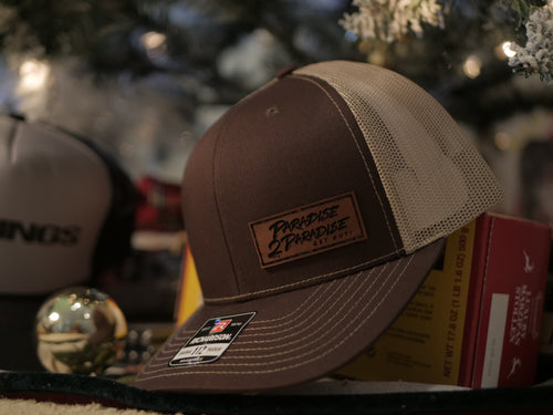 112-LP Richardson Leather Patch Trucker Cap. P2P Engraved in leather! Brown and light brown