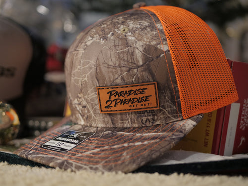 112-LP Richardson Leather Patch Trucker Cap. P2P Engraved in leather! Brown camo and orange